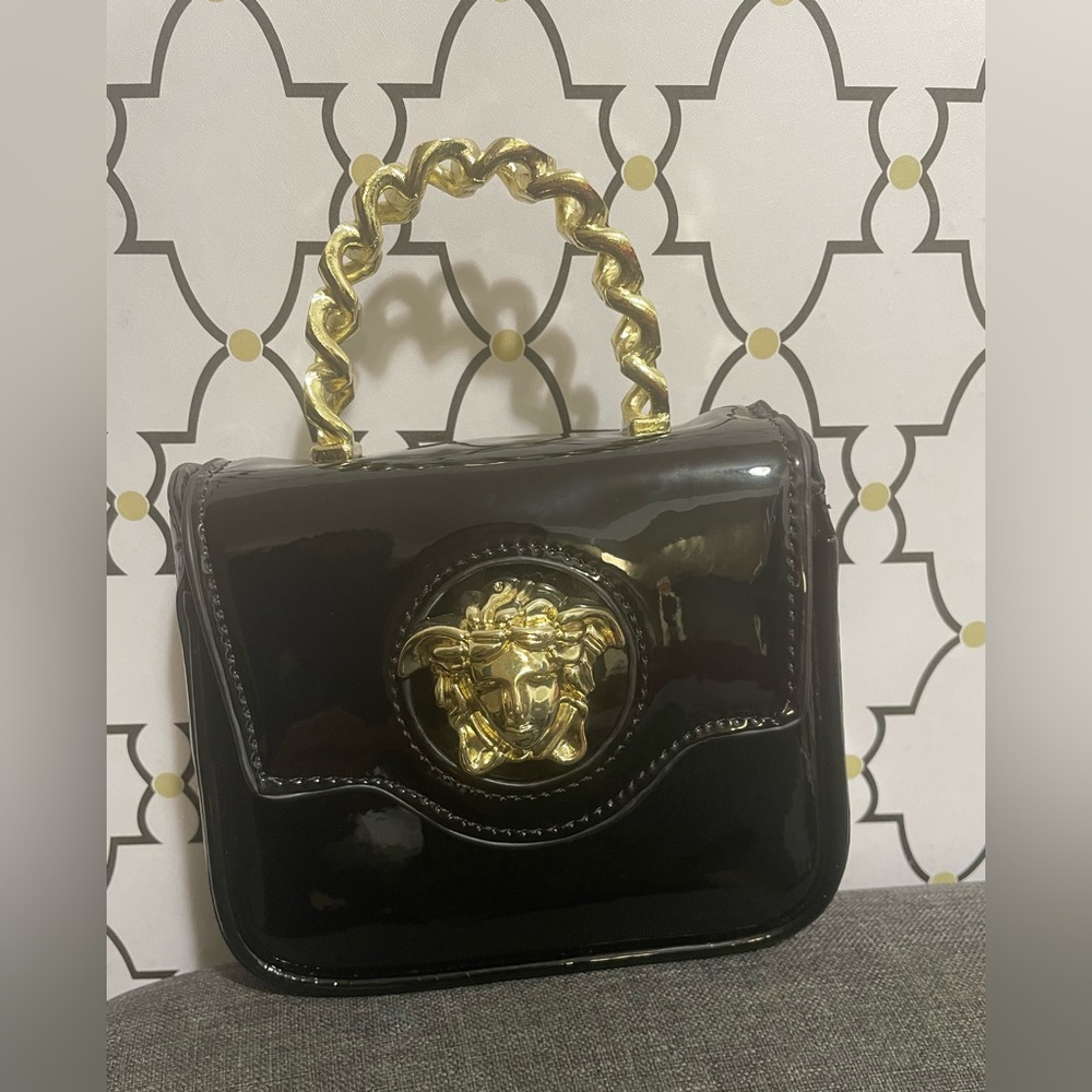 Mini patent black and gold crossbody bag